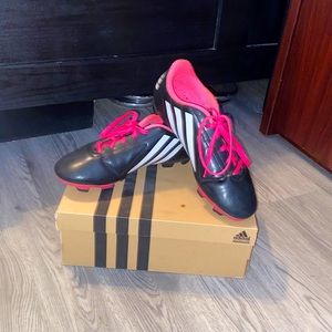 Pink and black cleats